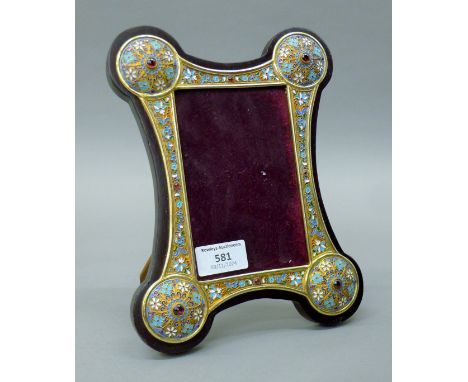 A silver and enamel photograph frame bearing Russian marks. 23.5 cm high. 
