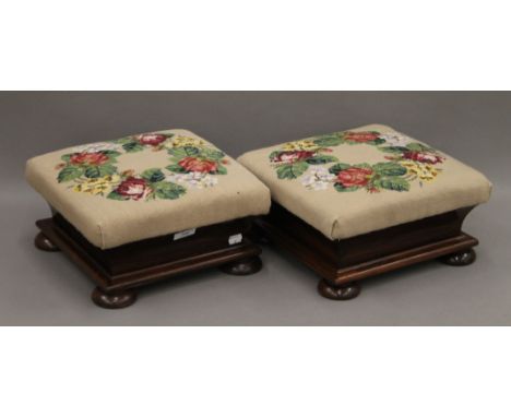 A pair of Victorian tapestry topped rosewood foot stools. 33 cm squared. 