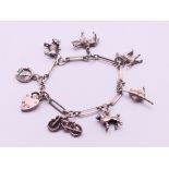 A silver charm bracelet. 16 cm long. 23.6 grammes.