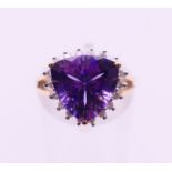 A 9 K gold amethyst and diamond ring. Ring size I/J.