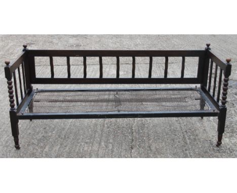 An early 20th century oak bobbin twist day bed. 184 cm long.