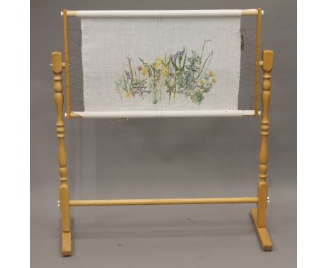 A tapestry frame with tapestry work. 96 cm wide.