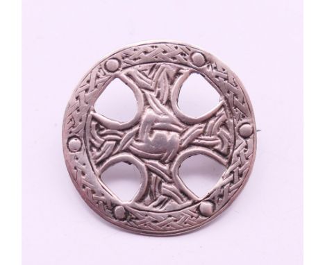 A Celtic silver brooch, hallmarked for Birmingham 1991, maker's mark W J & S. 2.75 cm diameter. 