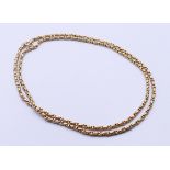 A 9 ct gold necklace. 76 cm long. 21.2 grammes.
