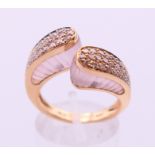 An 18 ct gold rose quartz and diamond dress ring marked "lo si" on one shoulder,
