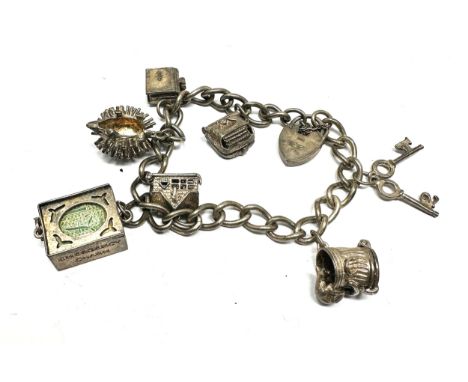 Vintage silver charm bracelet inc opening charms weight 40g