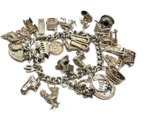Vintage silver charm bracelet inc opening charms weight 80g