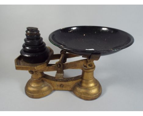 A Pair of Gilt Metal Kitchen Scales with Weights.