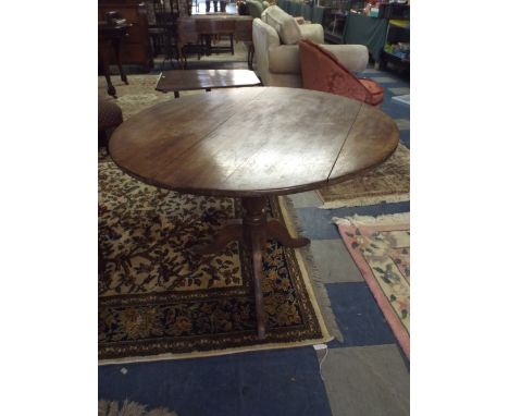 A Circular Snap Top Tripod Table in Mahogany.