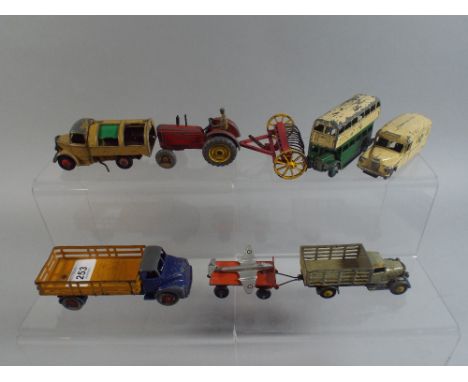 A Collection of Nine 1950's Dinky Toys 'Including Market Gardeners Lorry and Trailer, Leyland Comet, Massey Harris Tractor an