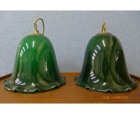 A pair of Art Deco green glass hanging light shades 