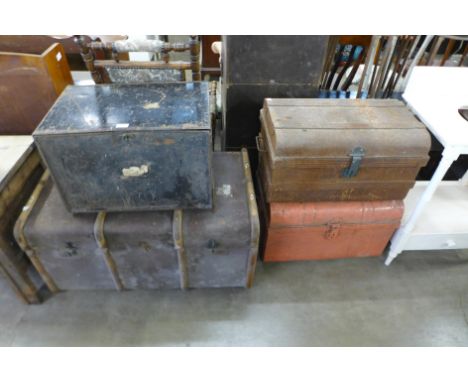 Two tin trunks, a banded travel trunk and a steel deed box 