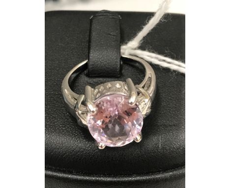 A 9ct white gold dress ring set with large oval cut pale pink amethyst