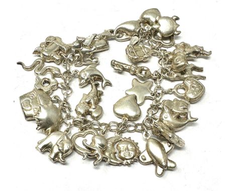 Vintage silver charm bracelet and charms weight 42g