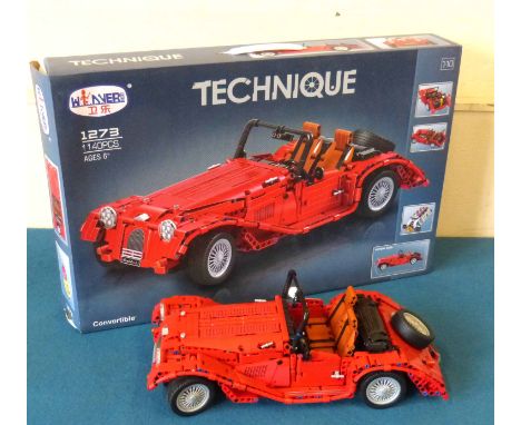 Technique (1273) V.6 red Morgan convertible, complete with box. Condition reports are not available for our Interiors Sales