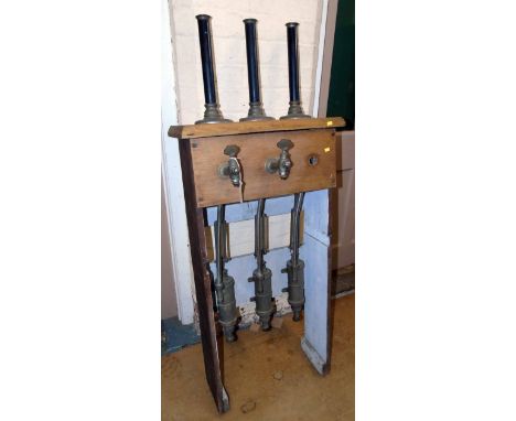 Set of three hand beer pumps in stand. Condition reports are not available for our Interiors Sales