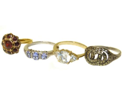 A selection of jewellery, to include a garnet cluster ring set in yellow metal, together with three further gem-set rings to 