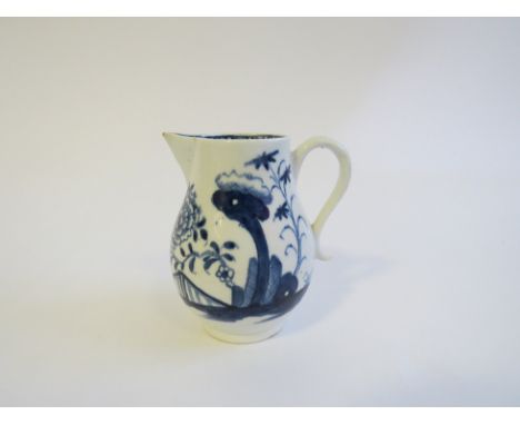 A Lowestoft porcelain blue and white painted baluster sparrow beak cream jug in "Triangular Gate" pattern, 8.5cm tall. Damage