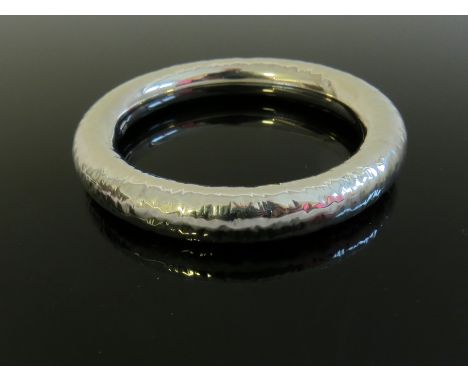 A planished bangle stamped 925
