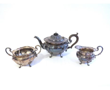 A Sibray, Hall and Co Ltd (Charles Clement Pilling) silver three piece tea set of classical form with shaped rims, scroll han