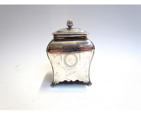 A silver tea caddy with pineapple finial engraved garland, London 1911, 305g