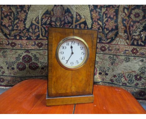 A Victorian flame walnut mantel clock of rectangular form, Arabic numerated dial, plinth base. Monks Hall Estate 