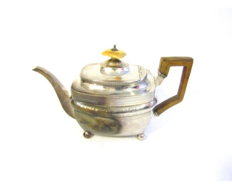 A Georgian silver teapot of rectangular form on ball feet with carved wooden handle and ivory finial. London, WS (William Str