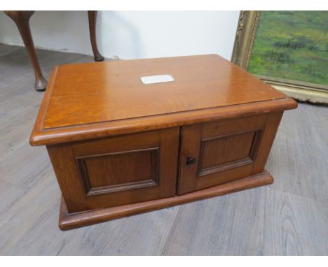 An Edwardian light oak canteen of cutlery for twelve place settings, with 1909 dated plaque to top. Monks Hall Estate