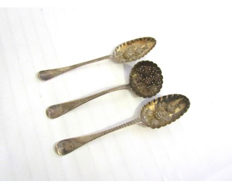 A matched pair of silver berry spoons including James Whiting, London 1830, 92g. Together with a similar William Chawner II s