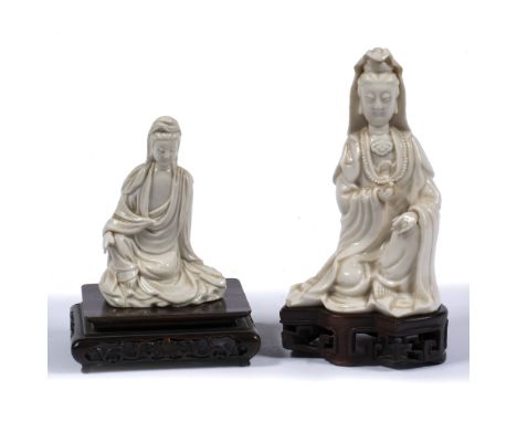 Dehua figure of seated Guanyin Chinese, 18th Century in long flowing robes and holding a hand scroll and wearing a bead neckl