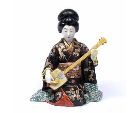 Kutani ware&nbsp;model of a kneeling geisha Japanese, Meiji playing a stringed instrument 22cm