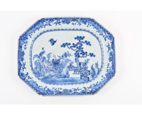 Blue and white large export charger Chinese, circa 1800 having garden scene with pine tree and two storks within a foliate sc