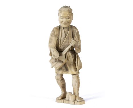 Carved ivory figure of a lute player Japanese, Meiji the standing figure playing the instrument with straw bag to his side 24