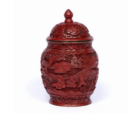 Cinnabar lacquer vase and cover Chinese the exterior with well carved garden scene with children playing set against a mounta