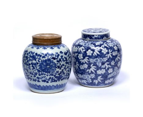 Two blue and white ginger jars Chinese, 19th Century the first decorated with flowering prunus against a crackled ground, Kan