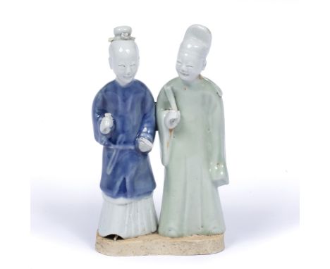 Pair of glazed standing Shiwan figures Chinese, Kangxione standing holding a fan, the other a small cup 17cm high
