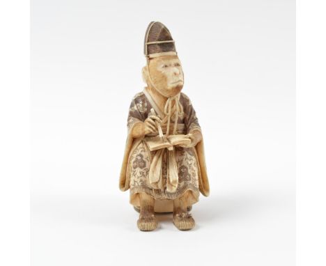 Ivory okimono Japanese, Meiji of a monkey priest sitting upon an open work stool while writing in an open book, robes and sto