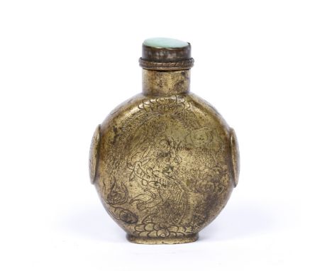 Gilt metal snuff bottle Chinese, 19th Century engraved with dragons, having a jade stopper