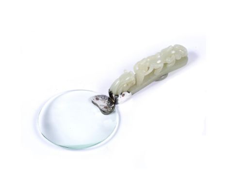 Jade belt hook and magnifying glass Chinese, Qing Dynasty 1644-1912 the hook undercut as horned dragon head, mounted on the b