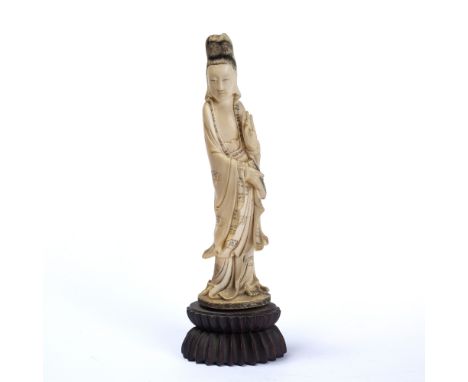 Ivory figure of a standing Xi Wang Mu Chinese, 1900-1920 holding a scroll with hands in mudra stance, robes etched in black w