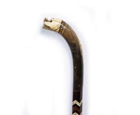 Mughal walking stick Indian, 18th/19th Century the tip modelled as an open mouthed serpent supported by horn, the body of the