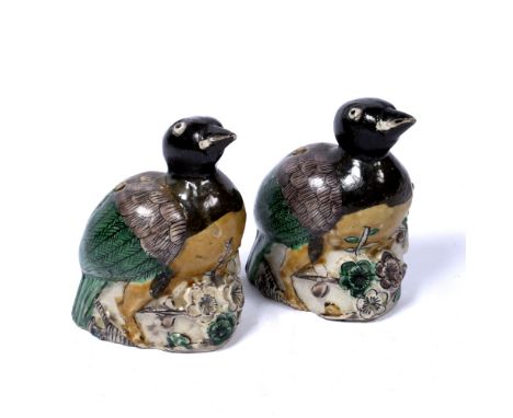 Pair of model chicks Chinese, Kangxi (1662-1722) the young birds crouched on a base with raised blossom 11.5cm high Old label