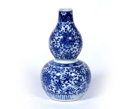 Double gourd vase Chinese, 19th century decorated with Indian lotus pattern, with Kangxi mark to base 18.5cm high