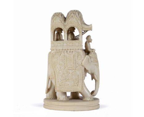 Ivory carved elephant and howdah Indian, circa 1900 the group having carved foliate scroll elephant cover 13.5cm high