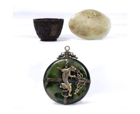 Jade and white metal pendant Chinese, circa 1900 having a raised shi-lin dragon 5.5cm a miniature Chinese coconut cup and a j