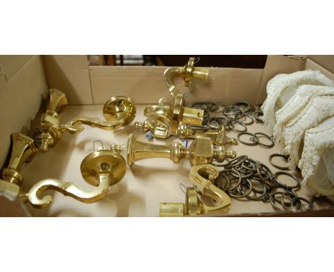 A circa 1900 floral pierced brass five light hanging electrolier; together with a further five light hanging electrolier; and