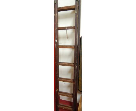 A stained pine window cleaners ladder, having adjustable action 