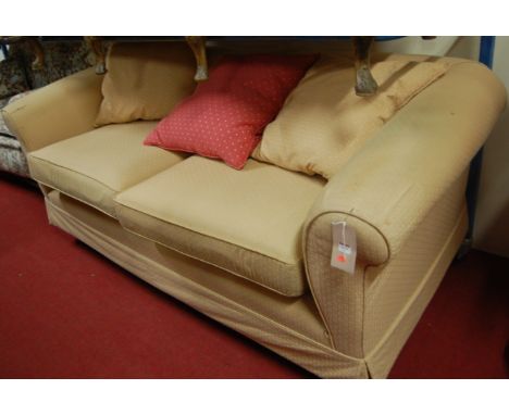 A modern yellow floral upholstered three-seater sofa