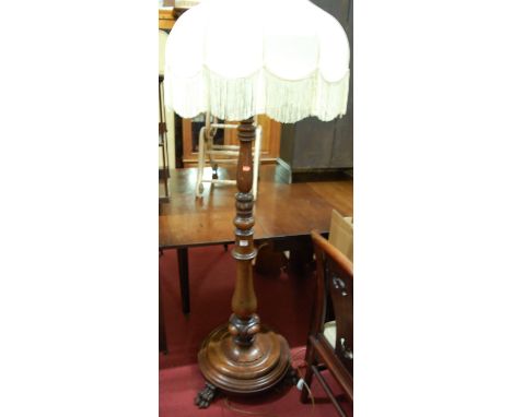 A Victorian turned mahogany standard lamp with silk shade