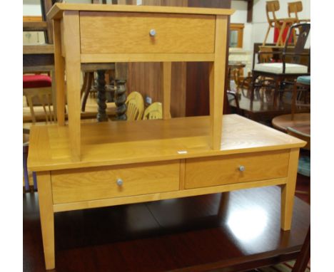 A contemporary light oak low two-drawer coffee table; together with a smaller single drawer example (2) 